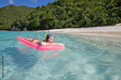 Woman enjoys sunny day at Caribbean beach. © Mirma