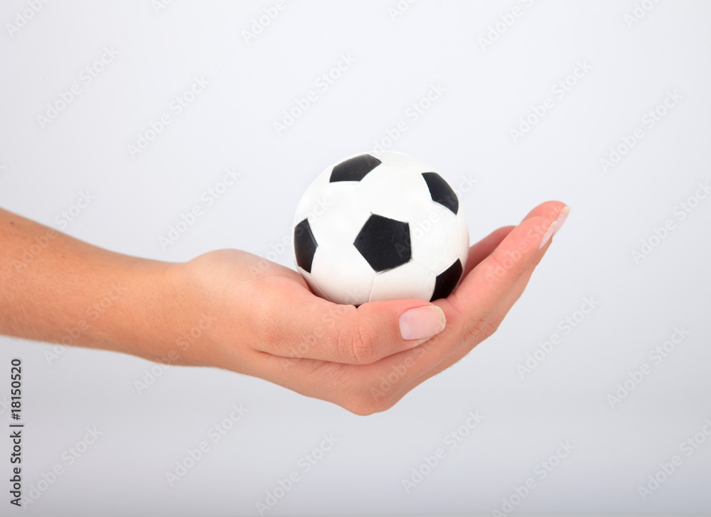 Hand with soccer ball Hand with soccer ball