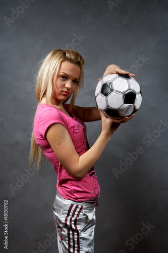 beautiful young blonde girl with soccer ball © fet