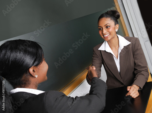 Multi-ethnic business team discussion with handshake