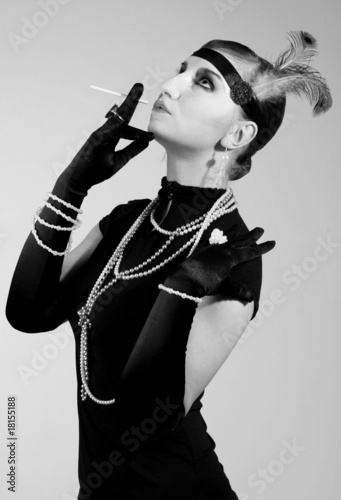 Retro fashion portrait of a young woman in twenties style