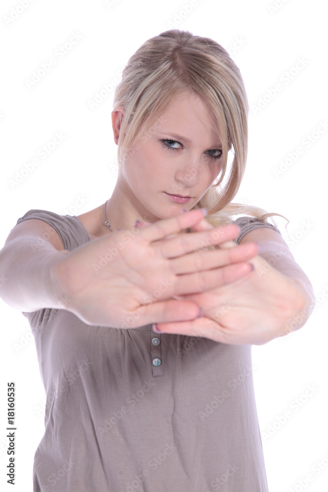 Fototapeta premium Junge Frau macht eine abweisende Gestik