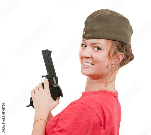 girl in overseas cap holding gun. photo