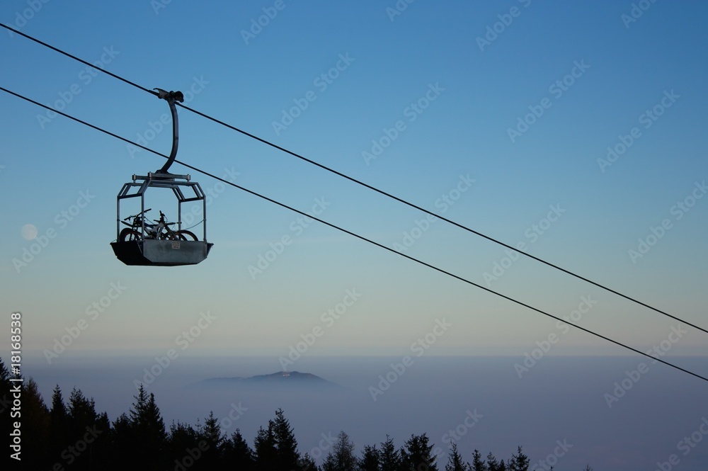 Mountain bike uphill transport in basket of cable-car
