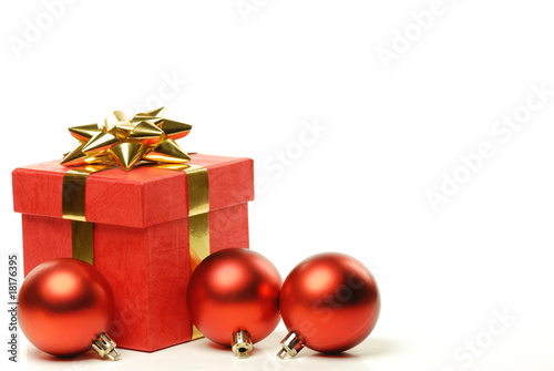 Red gift boxes and polished ball on white
