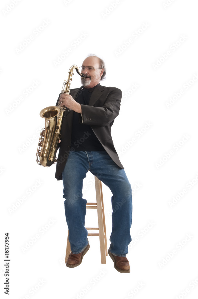 Fototapeta premium Playing a tenor sax seated on a stool