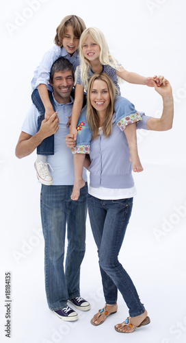 Happy family giving children piggyback ride