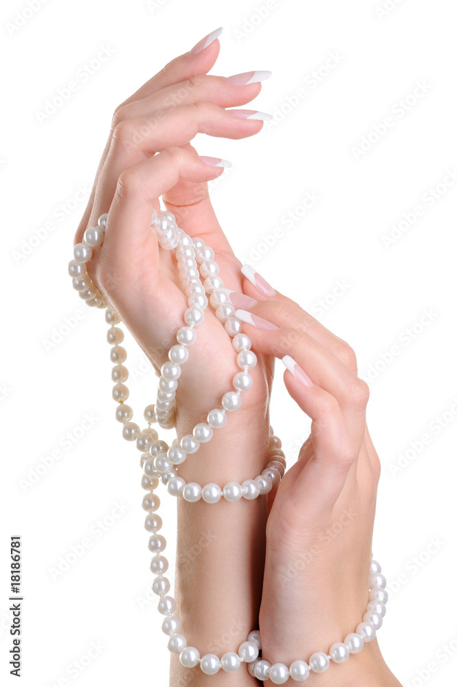 Beautiful elegant female hand with perl