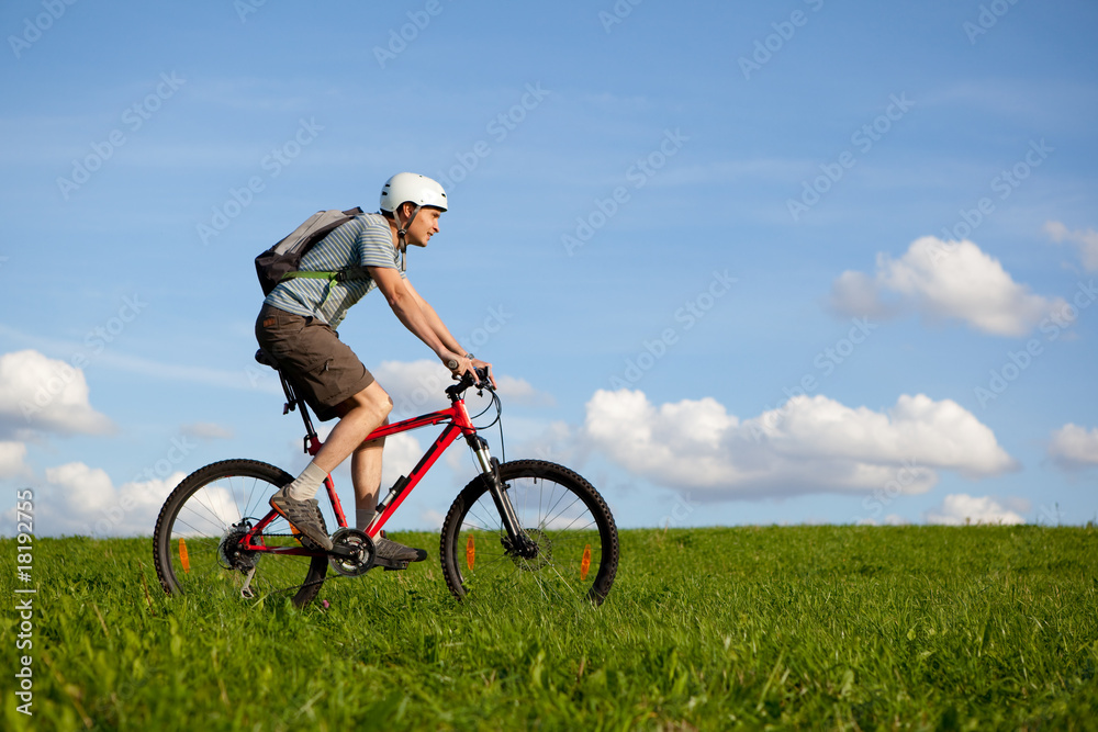 Men on mountain bike.