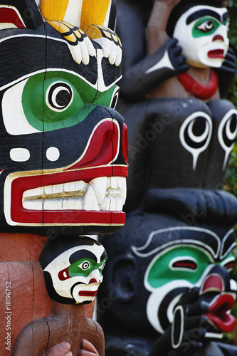 Partial view of Ga'akstalas and Sky chief totem poles. photo