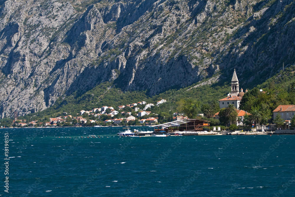 Settlement at the Kotor's Bay in front of mountains, Montenegro