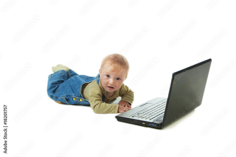 The small smiling happy kid with the laptop The small smiling happy kid with the laptop