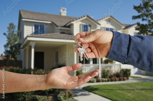 Bild auf Leinwand Handing Over the House Keys in Front of New Home