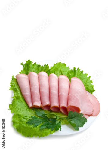 slices of pork and fresh greens
