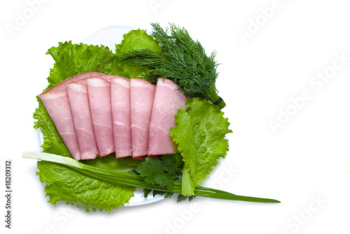 slices of pork and fresh greens