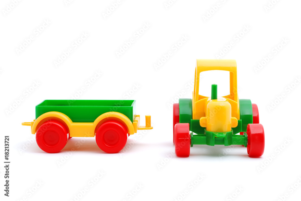 Small toy tractor isolated on white Small toy tractor isolated on white