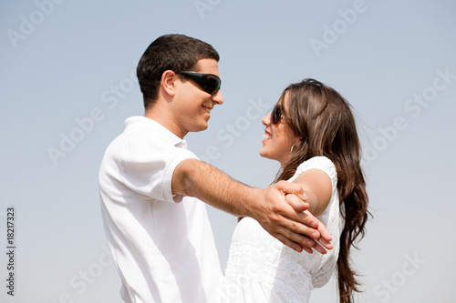 Couple holding hands and looking eachother