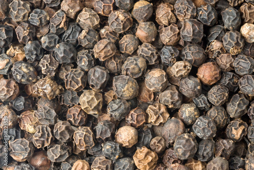 background of black peppercorns