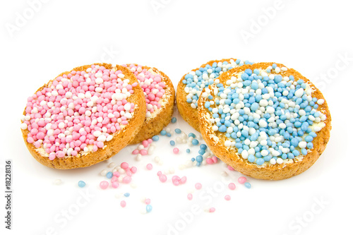 Rusk with blue and pink mice over white background