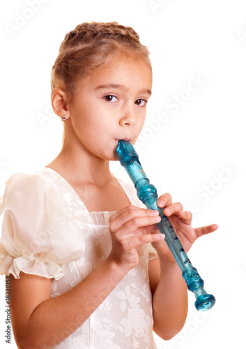 Little girl playing the flute