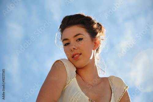 Beautiful young girl poses as model outdoors