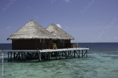 Bungalows in the lagoon, Maldives photo