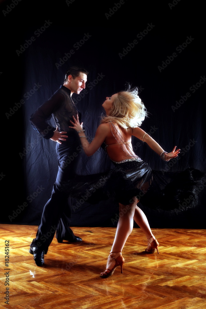 dancers in ballroom against black background dancers in ballroom against black background