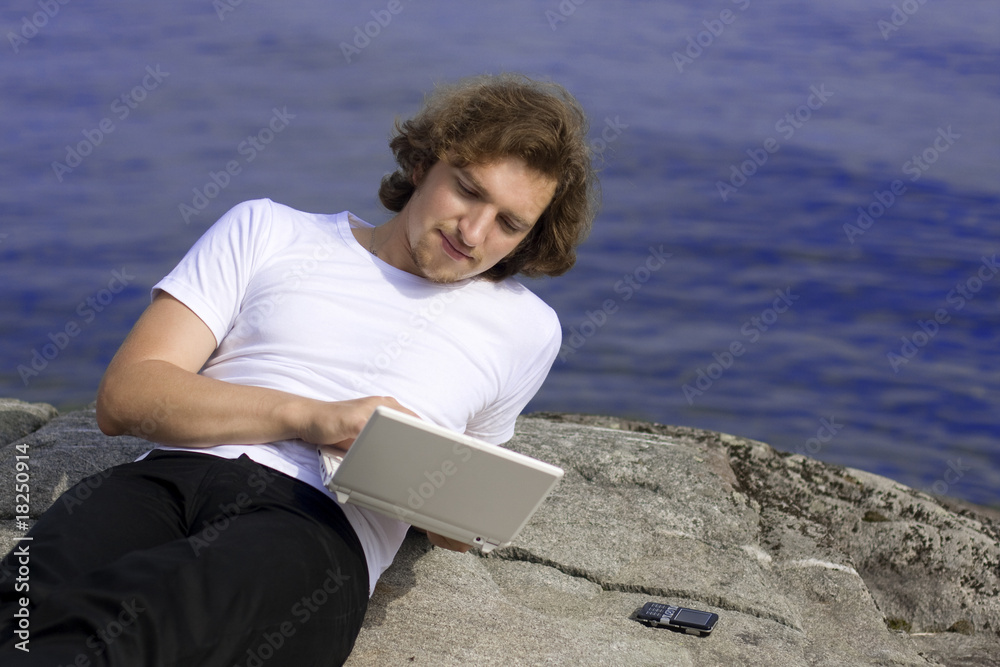 Man with a laptop in an outdoor