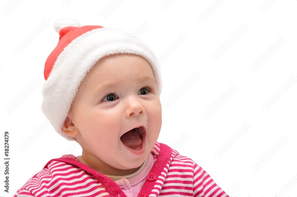 baby in Christmas bonnet looks at camera, on white baby in Christmas bonnet looks at camera, on white