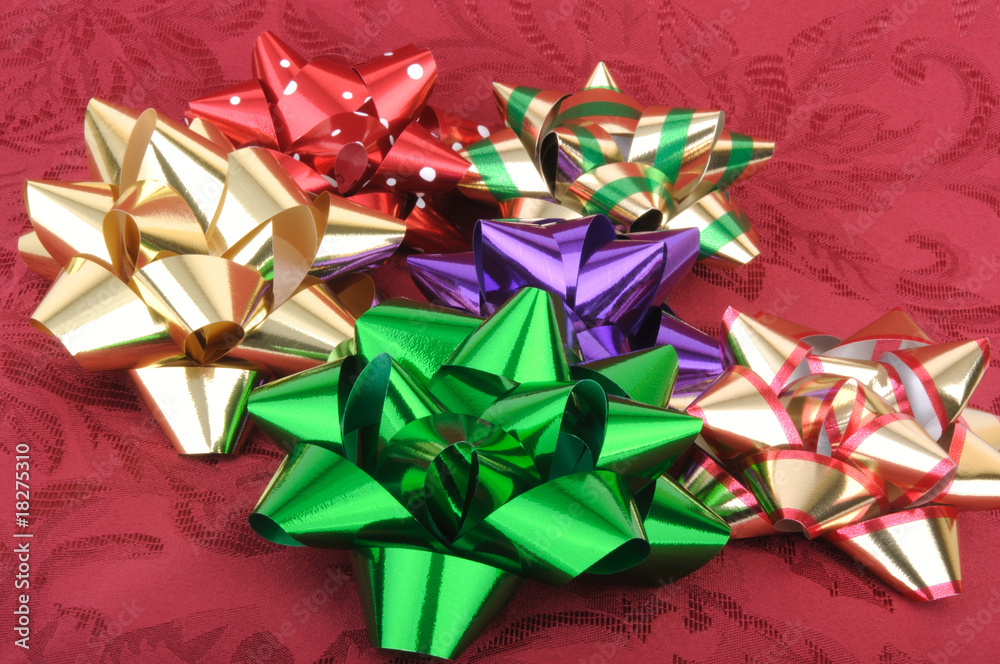 Colorful Christmas Bows on a Red Background Colorful Christmas Bows on a Red Background