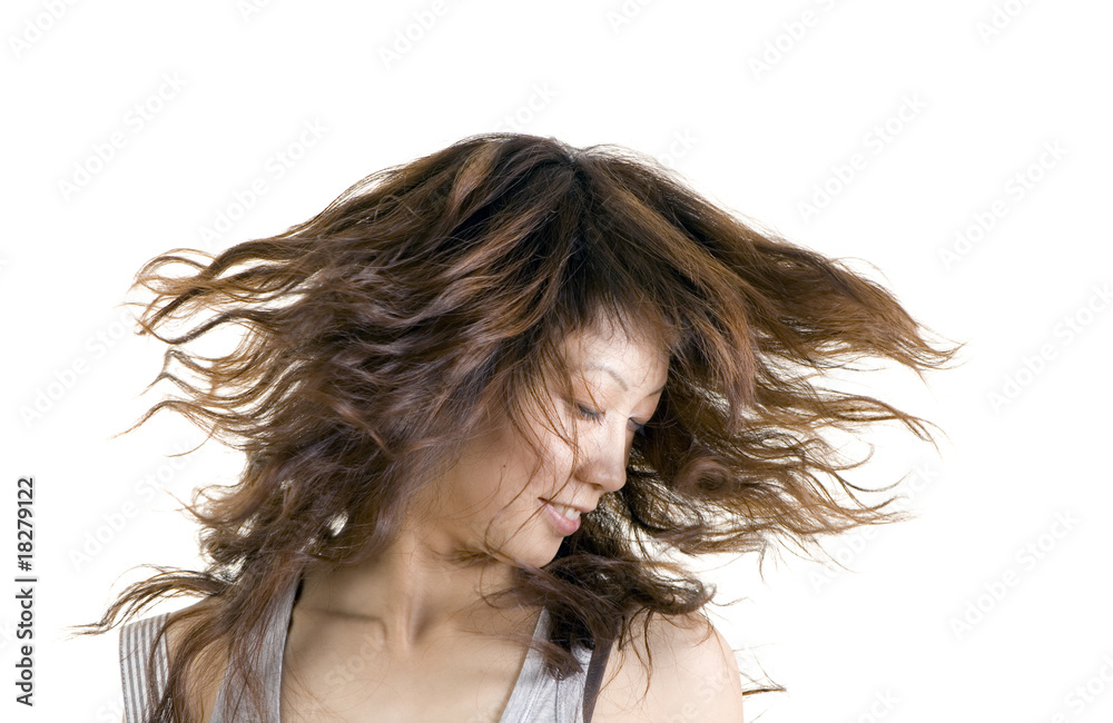 Portrait of a smiling female with fluttering hair Portrait of a smiling female with fluttering hair