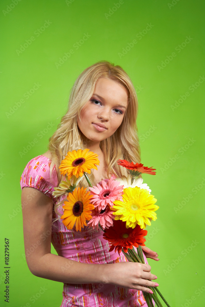 beautiful young blonde girl with a bouquet of flowers