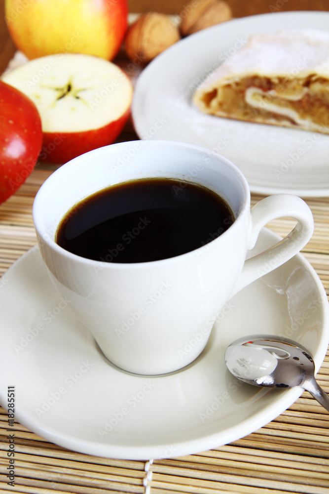 cup of coffee in white porcelain with apple strudel cup of coffee in white porcelain with apple strudel
