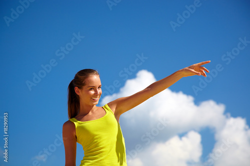 Portrait of the girl on a background of the dark blue sky
