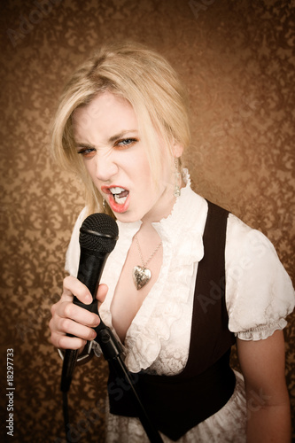 Pretty young singer or comedian with microphone