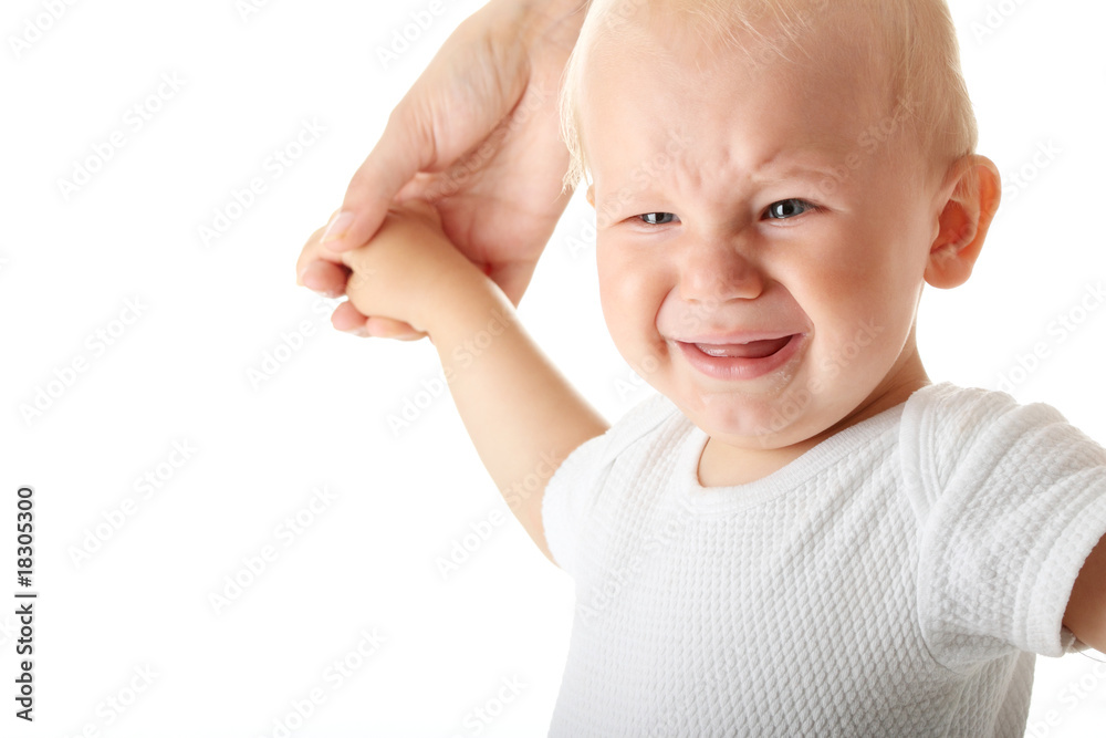 Mother holding her crying baby isolated