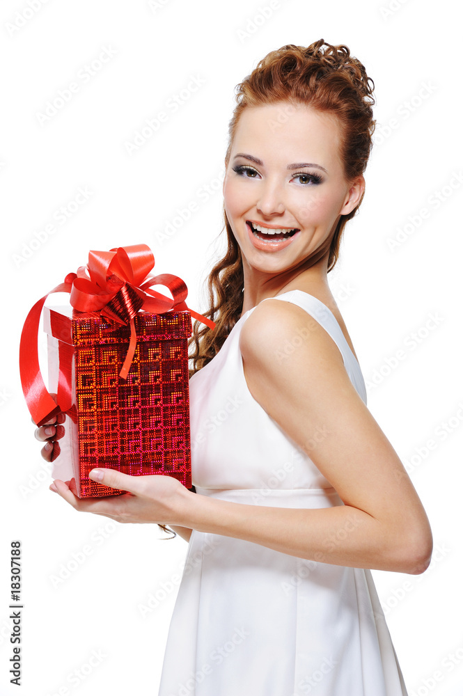 Pretty young laughing woman holding the gift Pretty young laughing woman holding the gift