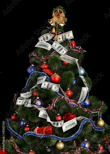 Christmas tree with money dollar garland. Black background.