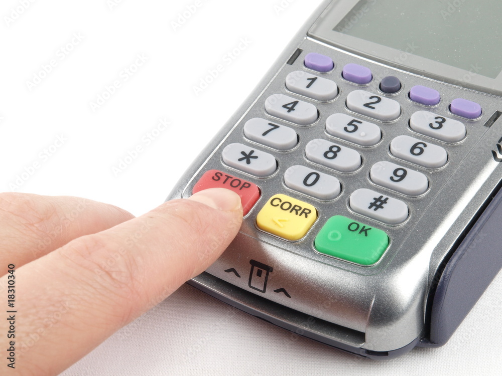 Payment terminal - a finger pressing red STOP button Payment terminal - a finger pressing red STOP button