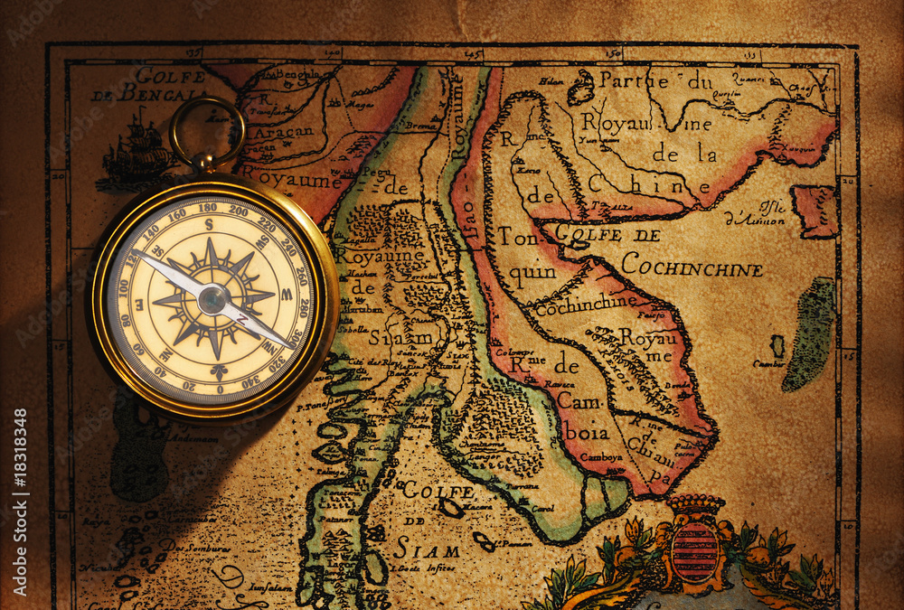 Old brass compass over antique Thailand map Old brass compass over antique Thailand map