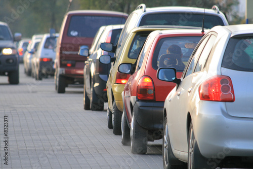 Rush hour traffic lined up car by car on the downtown streets