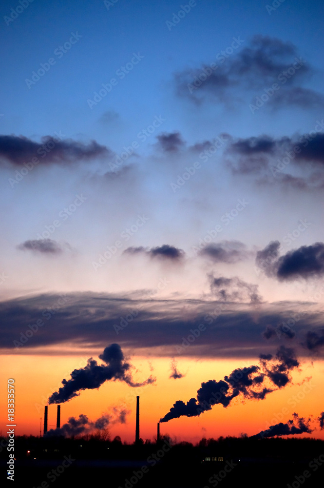 Fototapeta premium Pipes with a smoke on a decline