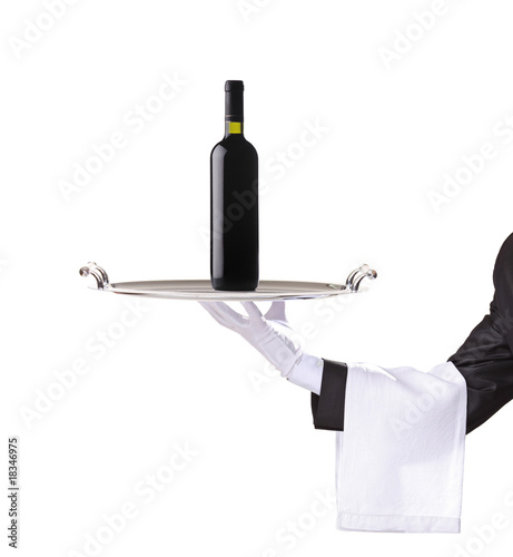 Waiter holding a silver tray with a red wine on it © Ljupco Smokovski