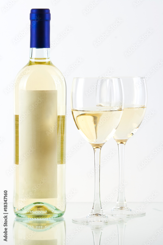 Bottle of white wine and two wine glasses Bottle of white wine and two wine glasses