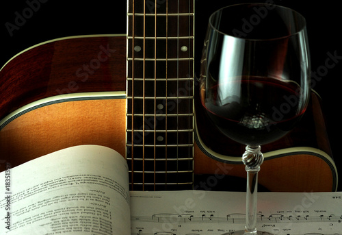 Guitar, book and wineglass