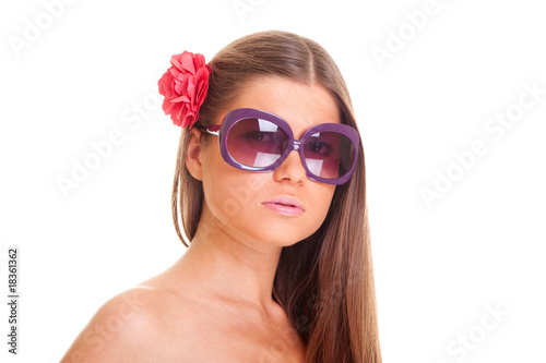 beautiful woman in sunglasses with flower
