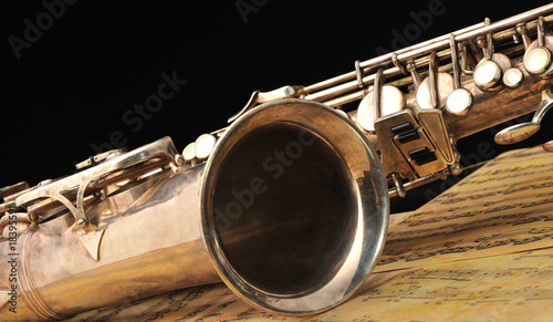 Old saxophone and notes photo