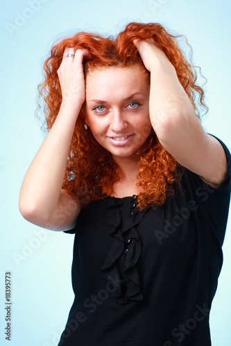 red haired woman on a blue background