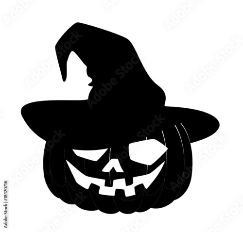 carved face of pumpkin glowing on Halloween is in the black hat
