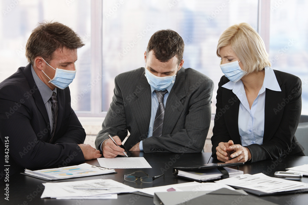 Business people fearing h1n1 virus Business people fearing h1n1 virus